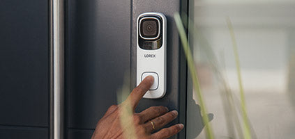 lifestyle image of finger pushing Lorex Smart Home Video Doorbell