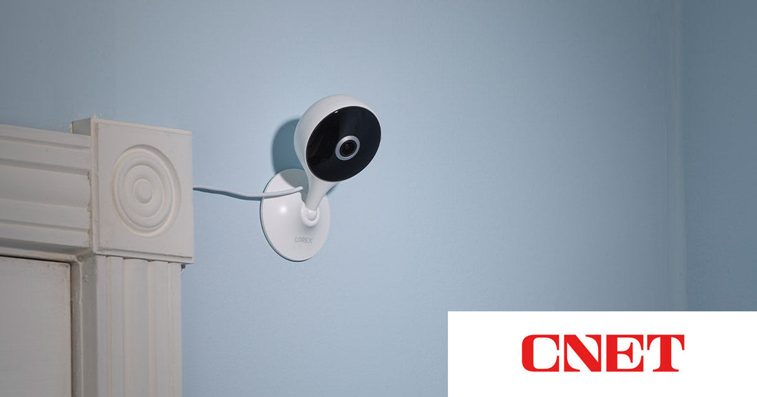 Lorex 2K Indoor Wi-Fi Camera mounted on a blue wall, featured in CNET’s roundup of the best affordable home security cameras for 2026.