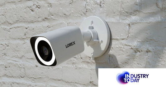 The Lorex 4K Wired PoE Bullet Camera mounted on a white brick wall, featuring Smart Security Lighting for enhanced visibility and deterrence.