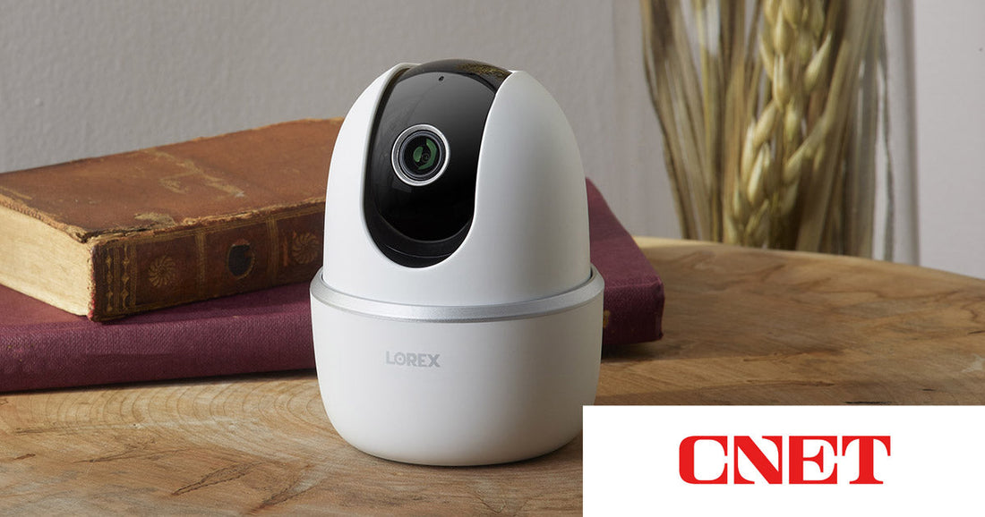 Lorex 2K Pan and Tilt Indoor Wi-Fi Camera placed on a wooden table, featured in CNET’s Prime Day 2025 coverage of indoor security camera deals.