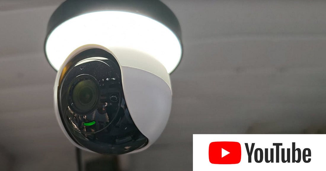 Lorex 2K lightbulb Wi-Fi camera installed in a ceiling socket with YouTube logo, highlighting easy home monitoring and video tutorials.
