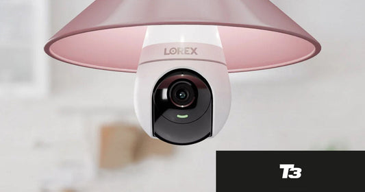 Lorex Wi-Fi lightbulb hanging from a pink lampshade in a kitchen