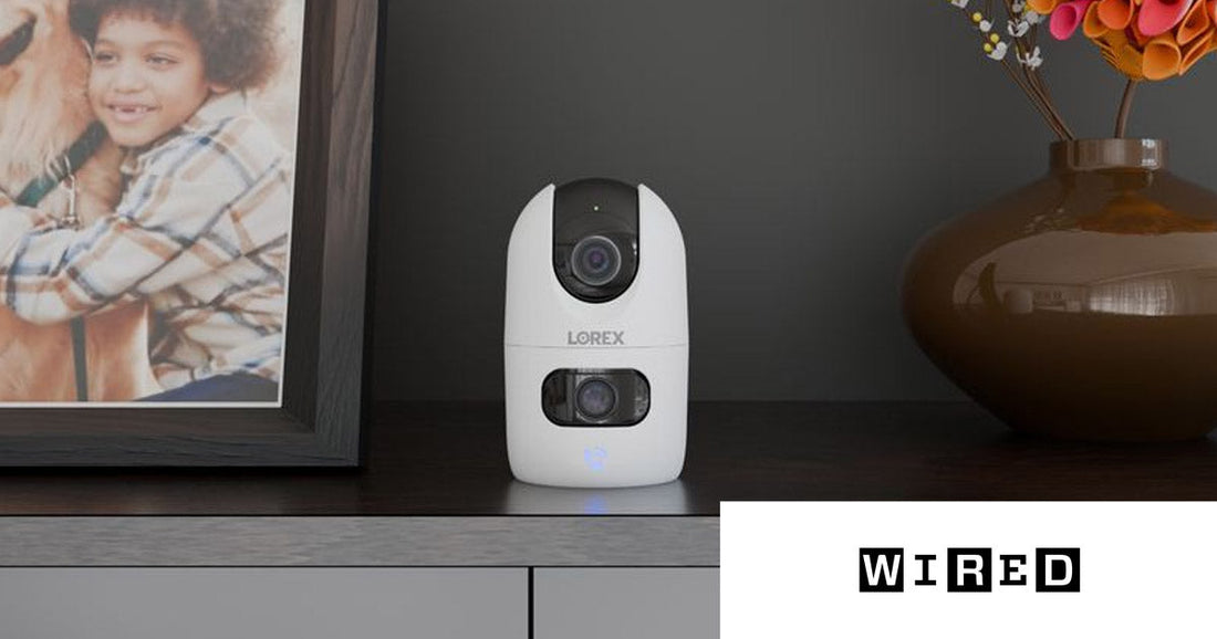 Lorex Connect 2K Dual-Lens Indoor Camera beside a framed photo of a child and dog, featured in WIRED's pet camera roundup.