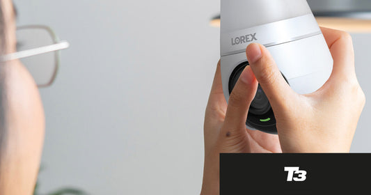 A person holding the Lorex Smart Lightbulb Camera during installation, featured in T3’s roundup of favorite affordable, subscription-free smart home security deals.