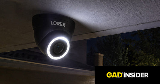 Lorex Connect T Series camera mounted under an eave at night with Smart Security Lighting, featured in GadInsider.