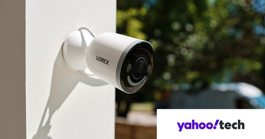 Lorex 4K Spotlight Wi-Fi Security Camera mounted on an exterior wall overlooking a yard in daylight, featured in Yahoo Tech’s roundup of the best subscription-free outdoor security cameras for 2026.