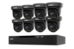 Eight black turret security cameras arranged in two rows above a matching black NVR box, all branded LOREX on a plain white background.