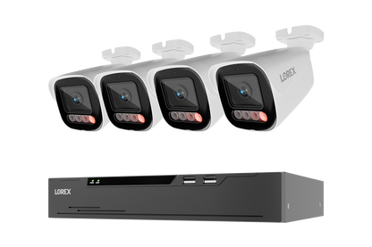 Four white Lorex security cameras with red IR LEDs shown above a black Lorex NVR receiver on a plain white background.