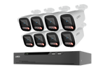 A 8-camera security video surveillance kit by LOREX, featuring eight white bullet cameras with black lenses and red indicator lights, paired with a black 8-channel NVR recorder, shown on a solid white background.