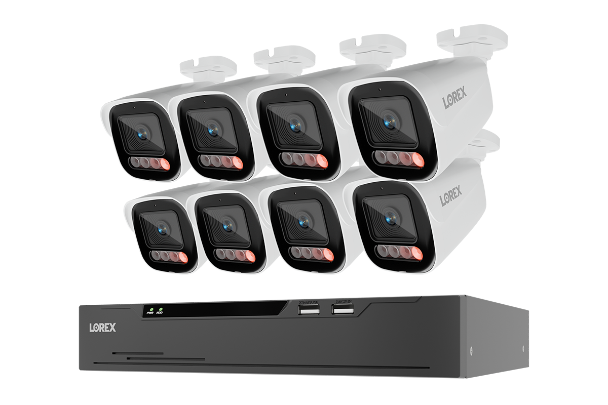 A 8-camera security video surveillance kit by LOREX, featuring eight white bullet cameras with black lenses and red indicator lights, paired with a black 8-channel NVR recorder, shown on a solid white background.