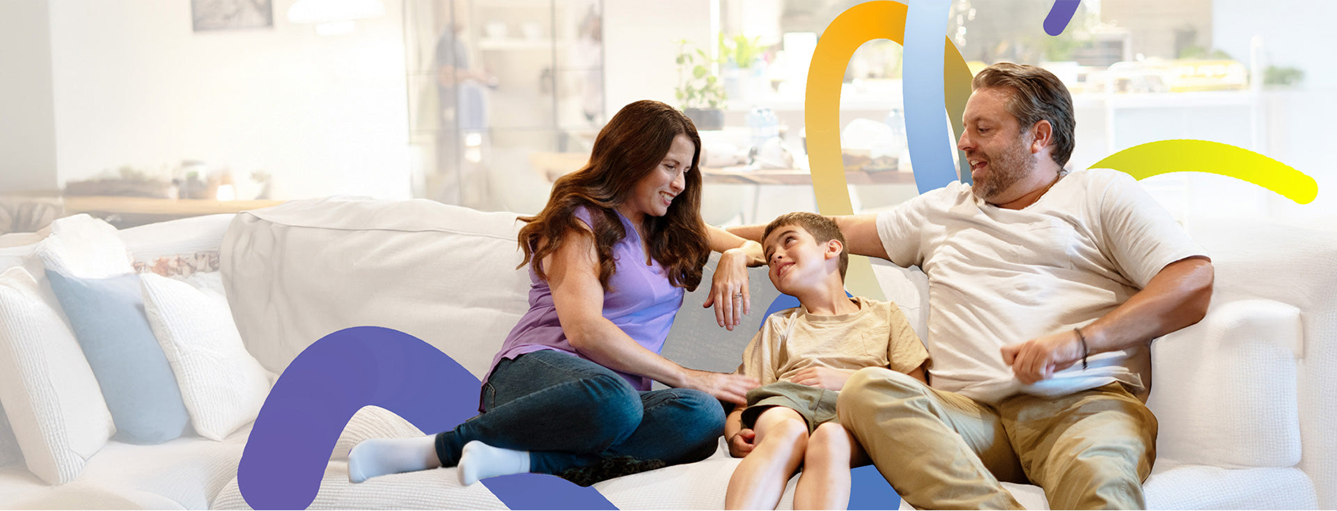 Family relaxing on couch at home with Lorex Connect smart home security.
